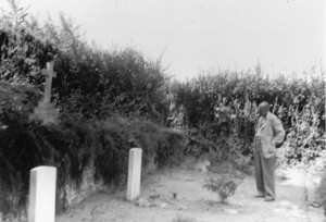 Billy Beach's father looks on at his son's grave post war.